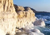 Salt and mineral deposits flank the Dead Sea in Jordan