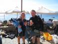 Two divers with their equipment ready to take the plunge