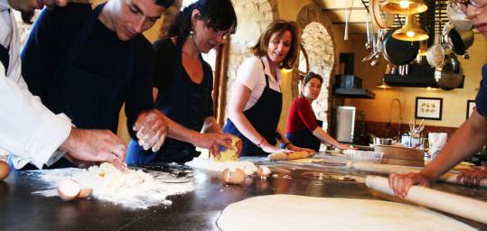 An On the Go group enjoying a cooking lesson