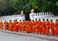 Buddhist monks are seen everywhere in Laos and a highlight of out Laos Tours.