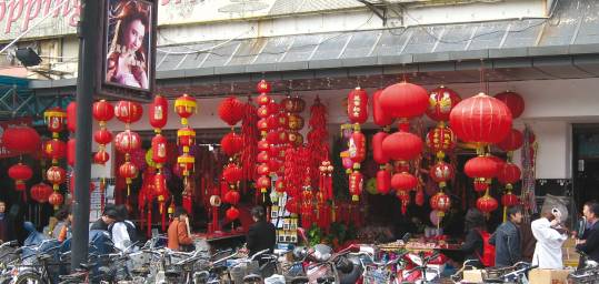 Bikes and bright red lanterns on a Beijing street