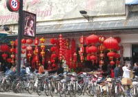 Bikes and bright red lanterns on a Beijing street