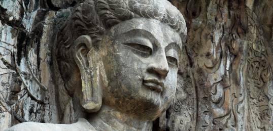A statue at the 6th Century Longman Caves, on the banks of the Yi River in Luoyang