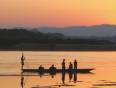 Boatmen on the Yi River at sunrise