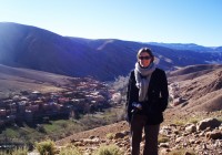 A lady standing by the beautiful Gorge Du Dades