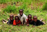 A group of smiling African children posing for a photo