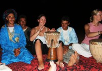 A girl learning to play the drum in Morocco