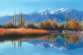 The Himalayan Mountains reflected in a lake