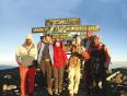 A happy group of trekkers, at the summit of Mt Kilimanjaro in Tanzania