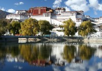 A lake side view of the Potala Palace in Lhasa