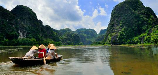 Locals head out in the water in Tam Doc in Vietnam.