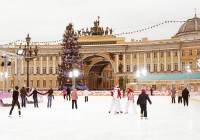 People ice skating in Palace Square in St Petersburg, where the Winter Palace is located