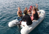 An on the go group on a zodiac which will transfer them from the ship to shore