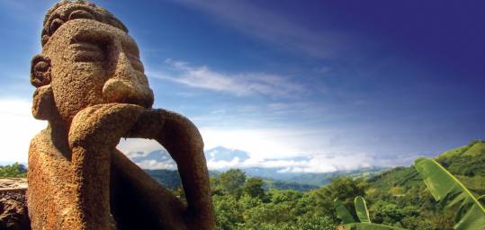 A famous stone statue in lush Costa Rica - a must see on a Costa Rica tour.