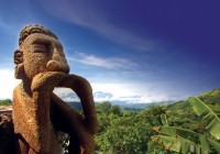 A famous stone statue in lush Costa Rica - a must see on a Costa Rica tour.