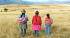 A family walking in Peru - meet the locals on our Peru Tours