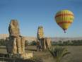 A hot air balloon by the Colossi of Memnon in Luxor