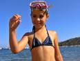A little girl in a snorkel by the sea in Hurghada