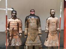 three warriors and a girl in one of the suits!