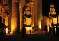 Statues of Ramses II, illuminated at the Luxor Temple