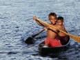 Two young Ecuadorian boys in a canoe