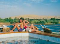 A couple by the pool on the deck of a Nile cruiser