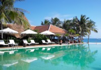 Sunset over the hotel pool and beach in Nha Trang, Vietnam