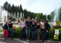 An on the go group by the gold fountains in the gardens of Peterhof Palace, St Petersburg