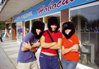 Three on the go passengers brave the cold of Russia with the help of some fluffy Ushanka hats
