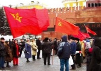 Russian people waving Socialist and Communist flags