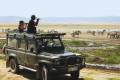 People game watching from their jeep on safari in Africa