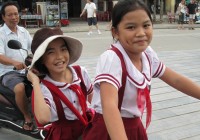 Home time! School girls on their way home in Hoi An