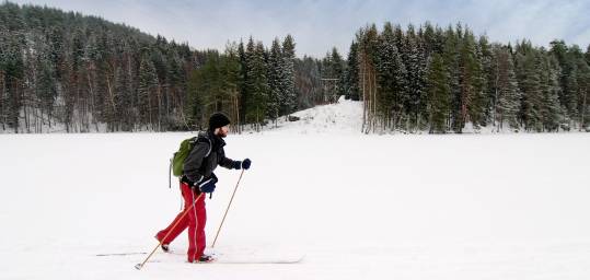 A man cross country skiing in the Ural Mountains, Russia