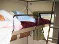 Person sleeping in an Egyptian sleeper train carriage