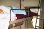 Person sleeping in an Egyptian sleeper train carriage