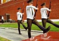 Three guards marching in step outside the Kremlin