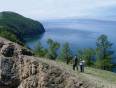 Two people trekking along the shores of Lake Baikal in Siberia