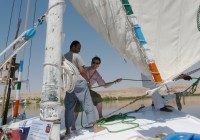 Men sailing a felucca on the Nile in Egypt