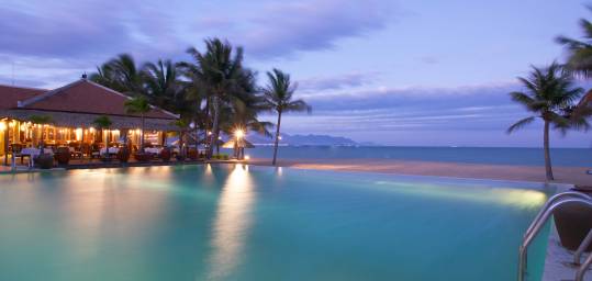 Sunset over the pool and beach in Nha Trang