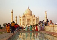 Colourfully dressed Indian people at the Taj Mahal