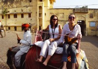 Two girls enjoying an elephant ride to the Amber fort