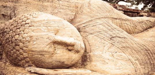 The giant reclining Buddha at Polonnaruwa as seen on a Sri Lanka tour.