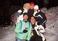 An on the go group posing for a photo in the snow