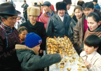 Mongolians gathered around a market stall in Ulaan Baatar