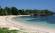 Pristine white sandy bay of Roatan Island in Honduras - relax here on a Central America tour.