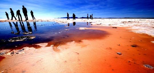 Laguna Colorada (a surreal bright red lake fringed with encrusted white minerals) in Bolivia