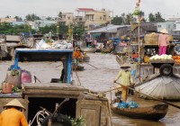 Traders at a floating market along the Mekong Delta