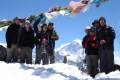 A group of trekkers in Nepal at the summit of Gokyo-Ri in the Himalayas