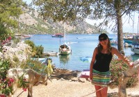A lady standing by the beautiful coastline in Marmaris