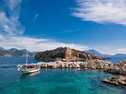 A small fishing boat in the turquoise waters of the Turkish Coast